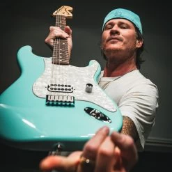 Fender Limited Edition Tom Delonge Stratocaster Electric Guitar In Daphne Blue -Professional Guitar Store 0148020304 Fender Limited Edition Tom Delonge Stratocaster Daphne Blue Lifestyle